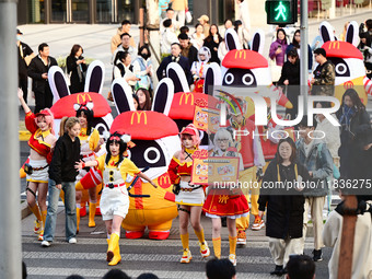 Products from the collaboration between the game Zenless Zone Zero and McDonald's parade through the streets in Shanghai, China, on December...