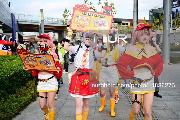 Products from the collaboration between the game Zenless Zone Zero and McDonald's parade through the streets in Shanghai, China, on December...