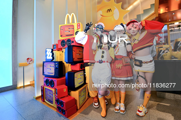 Products from the collaboration between the game Zenless Zone Zero and McDonald's parade through the streets in Shanghai, China, on December...