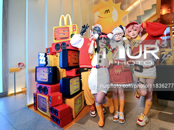 Products from the collaboration between the game Zenless Zone Zero and McDonald's parade through the streets in Shanghai, China, on December...