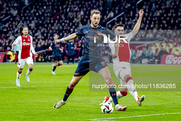 FC Utrecht forward David Min and AFC Ajax Amsterdam defender Josip Sutalo participate in the match between Ajax and Utrecht at the Johan Cru...