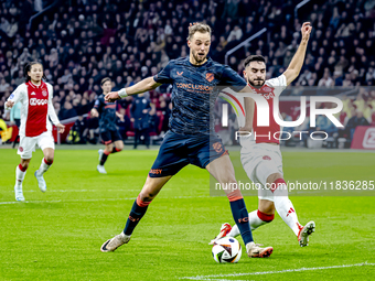 FC Utrecht forward David Min and AFC Ajax Amsterdam defender Josip Sutalo participate in the match between Ajax and Utrecht at the Johan Cru...