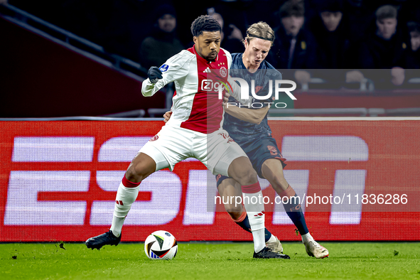 AFC Ajax Amsterdam forward Chuba Akpom and FC Utrecht defender Niklas Vesterlund play during the match between Ajax and Utrecht at the Johan...