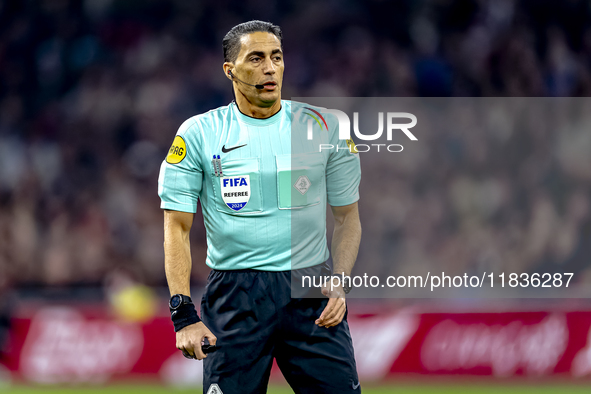 Referee Serdar Gozubuyuk officiates the match between Ajax and Utrecht at the Johan Cruijff ArenA for the Dutch Eredivisie season 2024-2025...