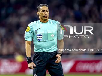 Referee Serdar Gozubuyuk officiates the match between Ajax and Utrecht at the Johan Cruijff ArenA for the Dutch Eredivisie season 2024-2025...