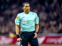 Referee Serdar Gozubuyuk officiates the match between Ajax and Utrecht at the Johan Cruijff ArenA for the Dutch Eredivisie season 2024-2025...