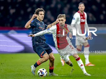 FC Utrecht forward Miguel Rodriguez and AFC Ajax Amsterdam midfielder Kenneth Taylor participate in the match between Ajax and Utrecht at th...