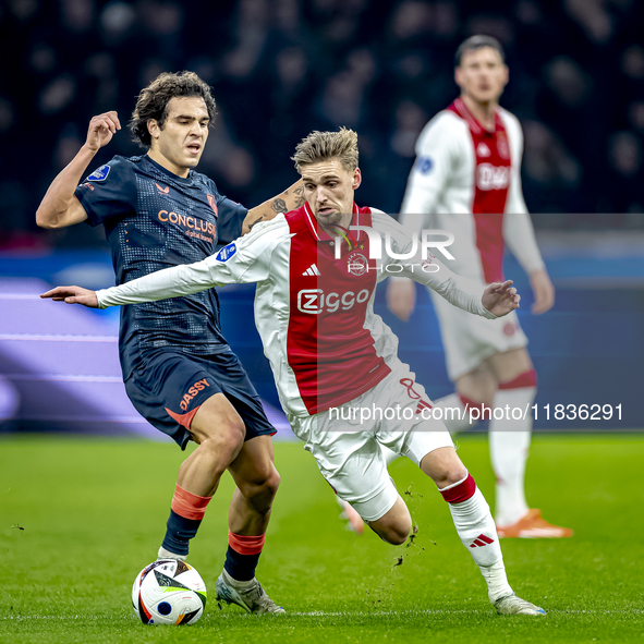 FC Utrecht forward Miguel Rodriguez and AFC Ajax Amsterdam midfielder Kenneth Taylor participate in the match between Ajax and Utrecht at th...