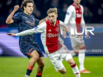 FC Utrecht forward Miguel Rodriguez and AFC Ajax Amsterdam midfielder Kenneth Taylor participate in the match between Ajax and Utrecht at th...