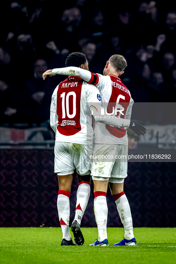 AFC Ajax Amsterdam forward Chuba Akpom and AFC Ajax Amsterdam midfielder Jordan Henderson participate in the match between Ajax and Utrecht...