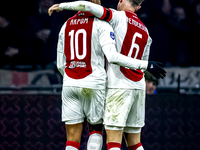 AFC Ajax Amsterdam forward Chuba Akpom and AFC Ajax Amsterdam midfielder Jordan Henderson participate in the match between Ajax and Utrecht...