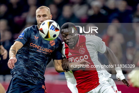 FC Utrecht defender Mike van der Hoorn and AFC Ajax Amsterdam forward Brian Brobbey play during the match between Ajax and Utrecht at the Jo...