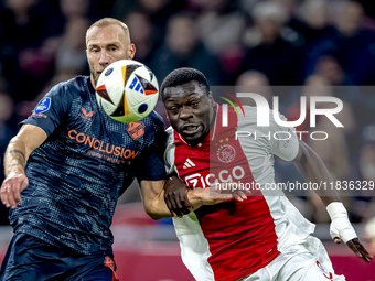 FC Utrecht defender Mike van der Hoorn and AFC Ajax Amsterdam forward Brian Brobbey play during the match between Ajax and Utrecht at the Jo...