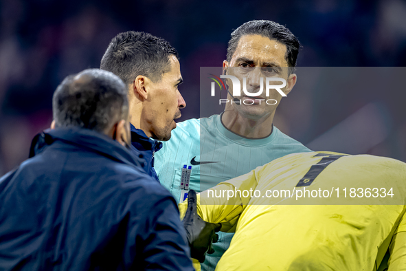 Referee Serdar Gozubuyuk officiates the match between Ajax and Utrecht at the Johan Cruijff ArenA for the Dutch Eredivisie season 2024-2025...