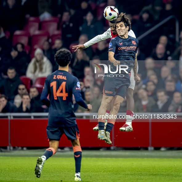 AFC Ajax Amsterdam defender Jorrel Hato and FC Utrecht midfielder Zidane Iqbal play during the match between Ajax and Utrecht at the Johan C...