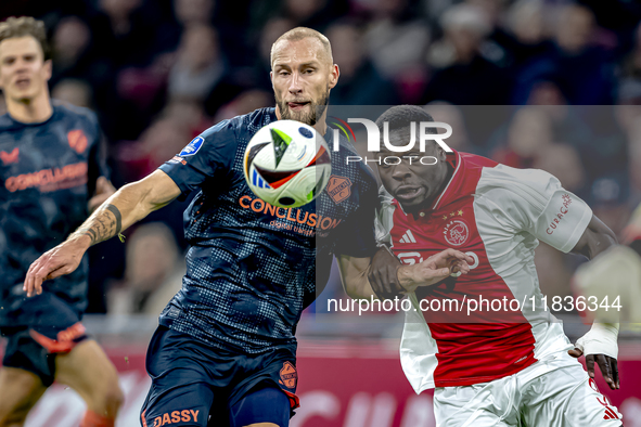 FC Utrecht defender Mike van der Hoorn and AFC Ajax Amsterdam forward Brian Brobbey play during the match between Ajax and Utrecht at the Jo...