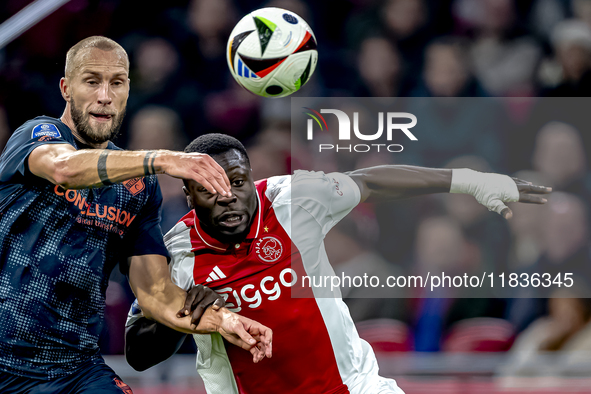 FC Utrecht defender Mike van der Hoorn and AFC Ajax Amsterdam forward Brian Brobbey play during the match between Ajax and Utrecht at the Jo...