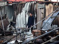 A Palestinian man inspects the damage in the aftermath of an Israeli strike on a tent camp in Khan Younis, Gaza Strip, on December 5, 2024,...