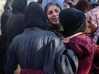 People mourn Palestinians killed in an Israeli strike at Nasser Hospital in Khan Younis in the southern Gaza Strip on December 5, 2024. (