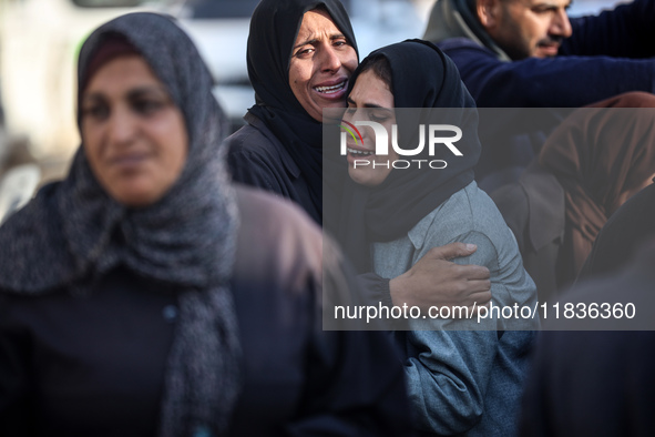 People mourn Palestinians killed in an Israeli strike at Nasser Hospital in Khan Younis in the southern Gaza Strip on December 5, 2024. 