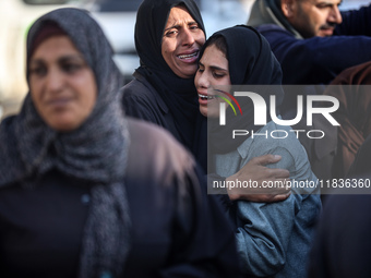 People mourn Palestinians killed in an Israeli strike at Nasser Hospital in Khan Younis in the southern Gaza Strip on December 5, 2024. (