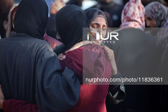 People mourn Palestinians killed in an Israeli strike at Nasser Hospital in Khan Younis in the southern Gaza Strip on December 5, 2024. 