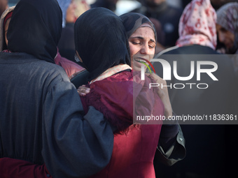 People mourn Palestinians killed in an Israeli strike at Nasser Hospital in Khan Younis in the southern Gaza Strip on December 5, 2024. (