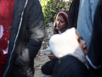 People mourn Palestinians killed in an Israeli strike at Nasser Hospital in Khan Younis in the southern Gaza Strip on December 5, 2024. (