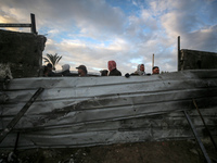 Palestinians inspect the damage in the aftermath of an Israeli strike on a tent camp in Khan Younis, Gaza Strip, on December 5, 2024, amid t...