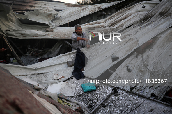 A Palestinian man inspects the damage in the aftermath of an Israeli strike on a tent camp in Khan Younis, Gaza Strip, on December 5, 2024,...