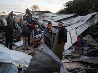 Palestinians inspect the damage in the aftermath of an Israeli strike on a tent camp in Khan Younis, Gaza Strip, on December 5, 2024, amid t...