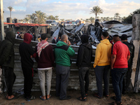 Palestinians inspect the damage in the aftermath of an Israeli strike on a tent camp in Khan Younis, Gaza Strip, on December 5, 2024, amid t...