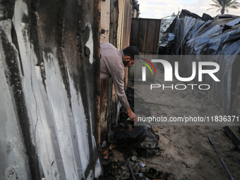 A Palestinian man inspects the damage in the aftermath of an Israeli strike on a tent camp in Khan Younis, Gaza Strip, on December 5, 2024,...