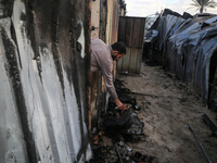 A Palestinian man inspects the damage in the aftermath of an Israeli strike on a tent camp in Khan Younis, Gaza Strip, on December 5, 2024,...