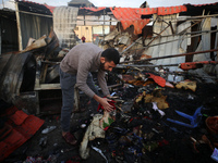 A Palestinian man inspects the damage in the aftermath of an Israeli strike on a tent camp in Khan Younis, Gaza Strip, on December 5, 2024,...