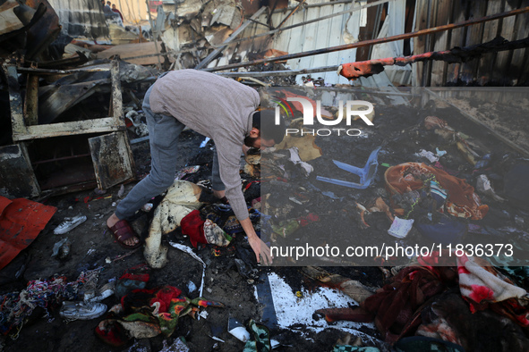 A Palestinian man inspects the damage in the aftermath of an Israeli strike on a tent camp in Khan Younis, Gaza Strip, on December 5, 2024,...