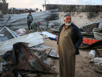 A Palestinian man inspects the damage in the aftermath of an Israeli strike on a tent camp in Khan Younis, Gaza Strip, on December 5, 2024,...