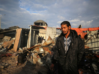 Palestinians inspect the damage in the aftermath of an Israeli strike on a tent camp in Khan Younis, Gaza Strip, on December 5, 2024, amid t...