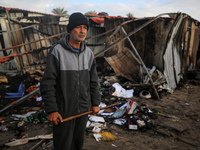 A Palestinian man inspects the damage in the aftermath of an Israeli strike on a tent camp in Khan Younis, Gaza Strip, on December 5, 2024,...