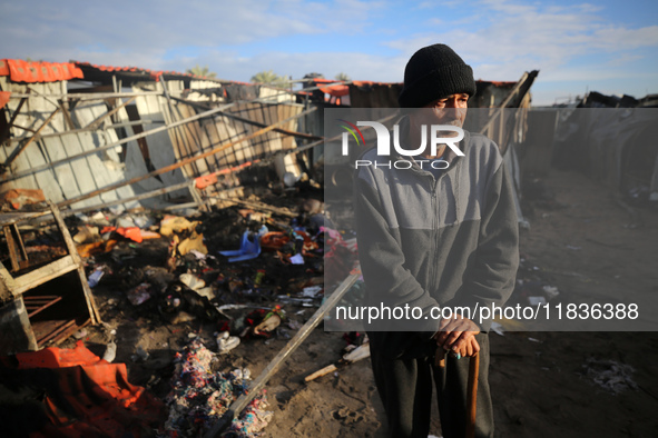 A Palestinian man inspects the damage in the aftermath of an Israeli strike on a tent camp in Khan Younis, Gaza Strip, on December 5, 2024,...