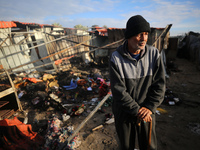 A Palestinian man inspects the damage in the aftermath of an Israeli strike on a tent camp in Khan Younis, Gaza Strip, on December 5, 2024,...