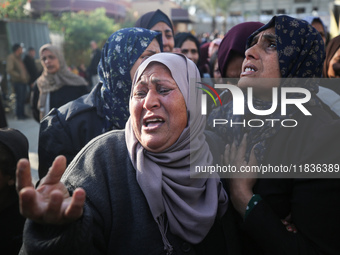 People mourn Palestinians killed in an Israeli strike at Nasser Hospital in Khan Younis in the southern Gaza Strip on December 5, 2024. (