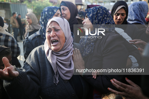 People mourn Palestinians killed in an Israeli strike at Nasser Hospital in Khan Younis in the southern Gaza Strip on December 5, 2024. 