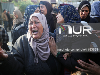 People mourn Palestinians killed in an Israeli strike at Nasser Hospital in Khan Younis in the southern Gaza Strip on December 5, 2024. (