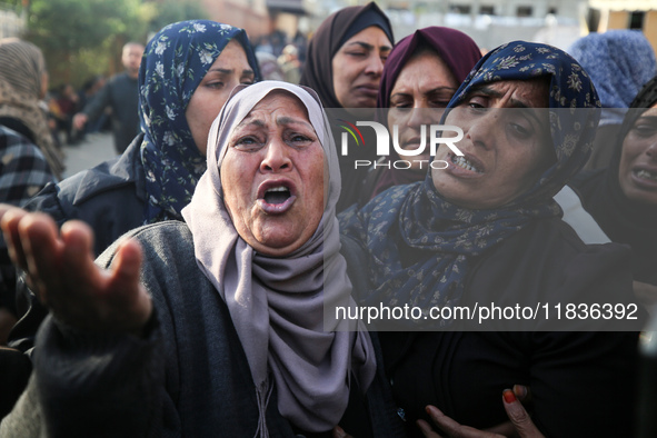 People mourn Palestinians killed in an Israeli strike at Nasser Hospital in Khan Younis in the southern Gaza Strip on December 5, 2024. 