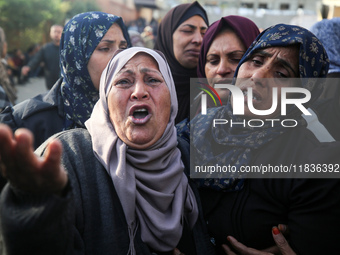 People mourn Palestinians killed in an Israeli strike at Nasser Hospital in Khan Younis in the southern Gaza Strip on December 5, 2024. (