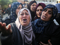 People mourn Palestinians killed in an Israeli strike at Nasser Hospital in Khan Younis in the southern Gaza Strip on December 5, 2024. (