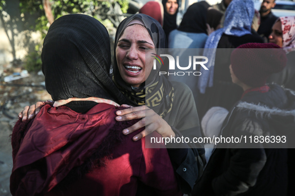 People mourn Palestinians killed in an Israeli strike at Nasser Hospital in Khan Younis in the southern Gaza Strip on December 5, 2024. 