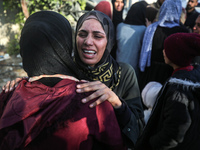 People mourn Palestinians killed in an Israeli strike at Nasser Hospital in Khan Younis in the southern Gaza Strip on December 5, 2024. (