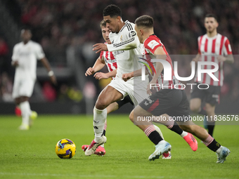 Jude Bellingham central midfield of Real Madrid and England surrounded by Athletic players during the La Liga match between Athletic Club an...